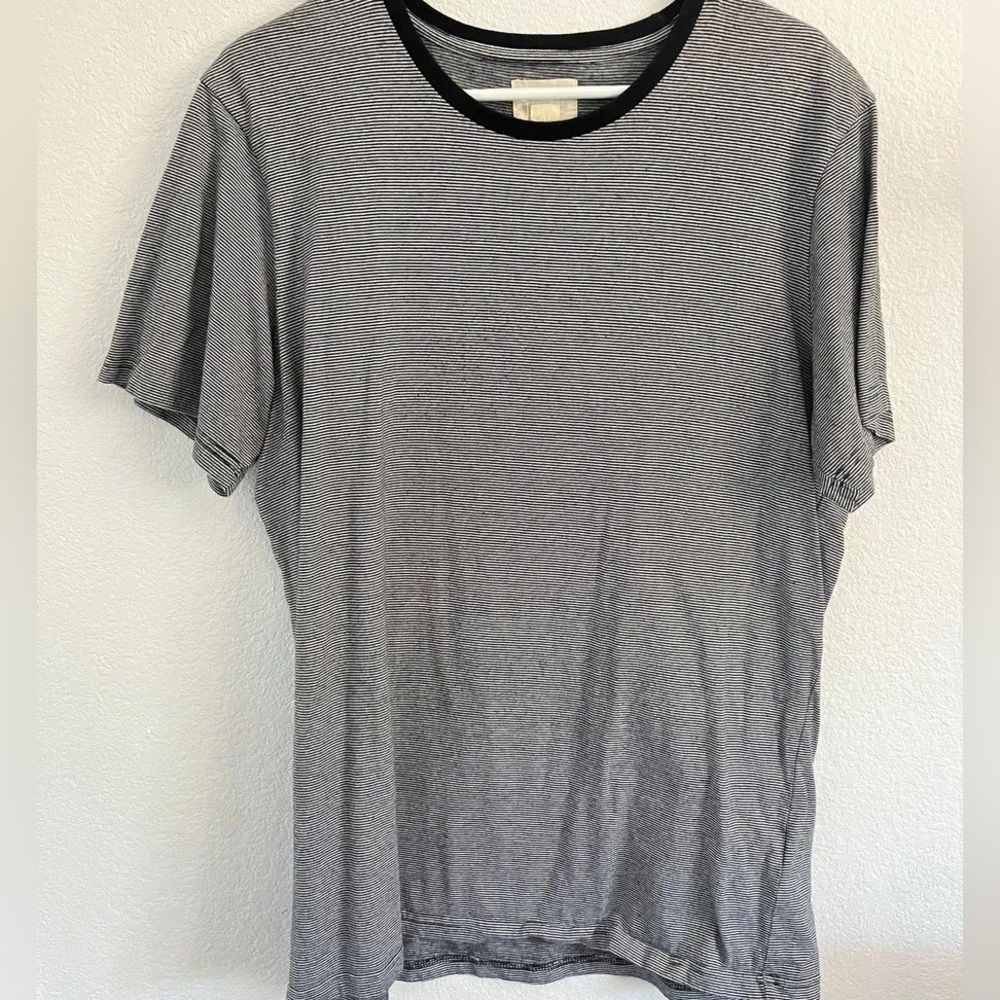 Black and white striped shirt size XL fits more like L